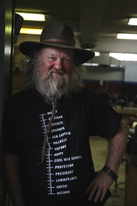 BYE BILL: Mulwaree High School’s art metal teacher Bill Dorman in his workshop last week. Owner of one of the more recognisable beards in Goulburn, some of Mr Dorman’s students purchased this t-shirt for him, which was delivered while he was talking to the Goulburn Post.
