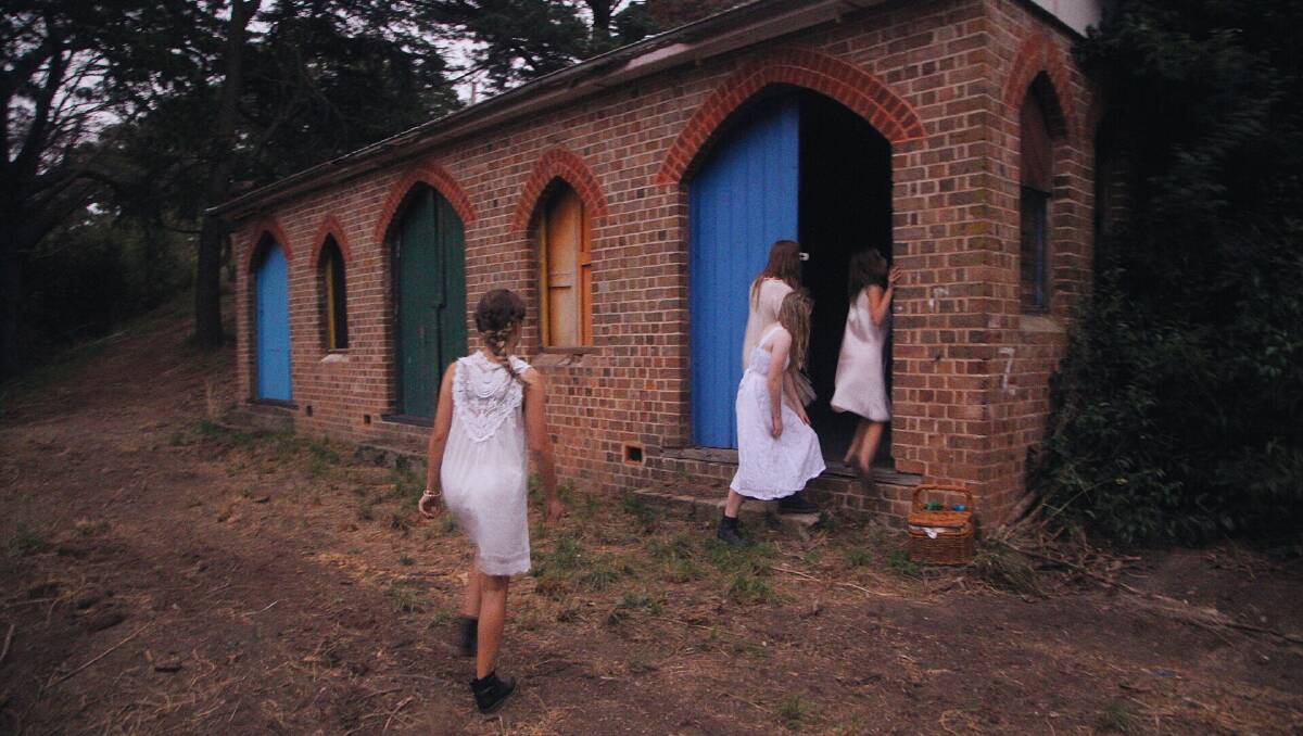 Goulburn Post journalist Brittany Murphy shot this haunting photo down at the old
boathouse, at the bottom of Wollondilly Ave, Kenmore on Friday. The photo evokes the turn of last century, when the boathouse was a popular recreational facility in the city. Miranda Murphy, Emma O’Flynn, Jayde-Ellen Butz and Molly Stamatellis are pictured near the old boathouse. 