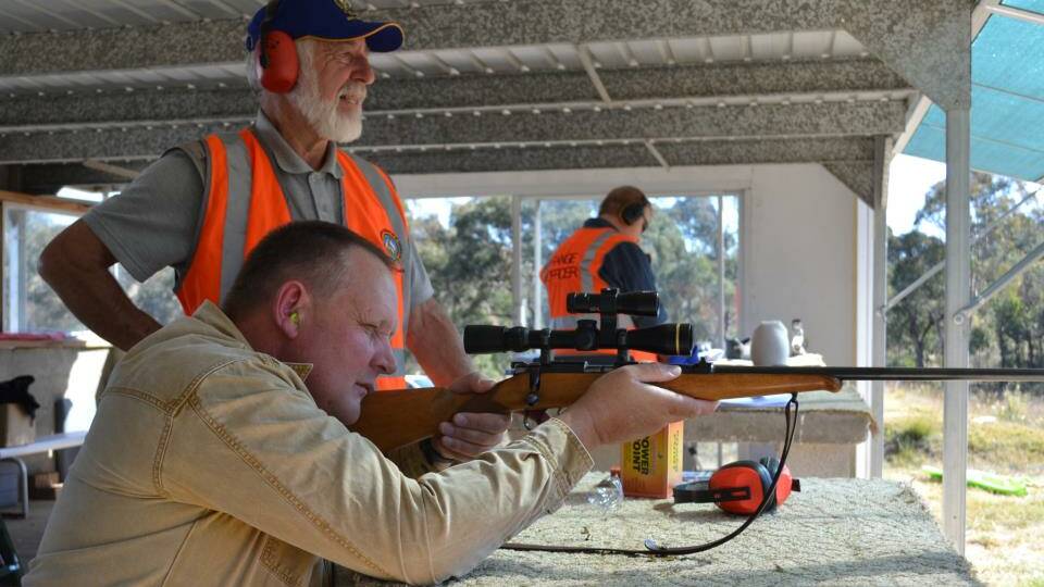 PERFECT AIM: President of the Sporting Shooters Association of Australia’s Goulburn branch, Ken Kenchington oversees a shooting day at the local rifle range last October. 
