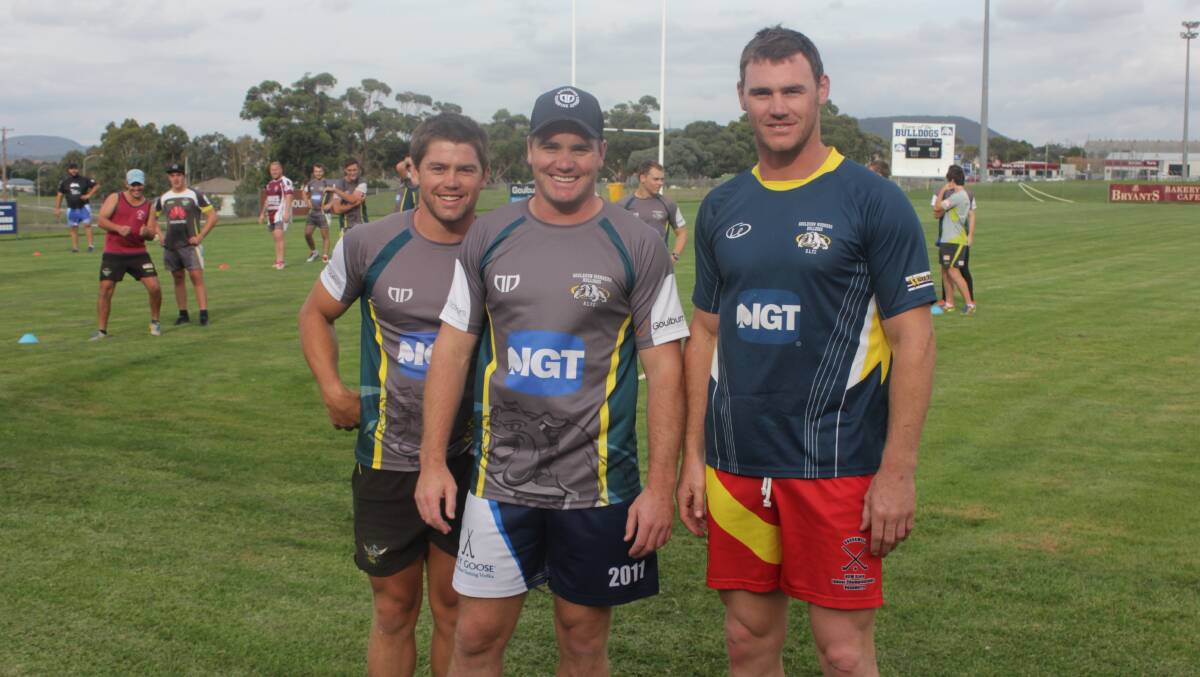 PICKER BROTHERS: Youngest brother Ben,
captain and coach of the Bulldogs Michael,
and 121 NRL game veteran Joe Picker at
Bulldogs pre-season training on Tuesday.
Photo: Chris Clarke