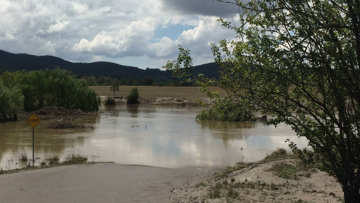 Mills Road crossing at the Wollondilly River during the sudden flood in February. Somewhere under that water is a fence and a couple of two metre water level markers. Photo: M Burman