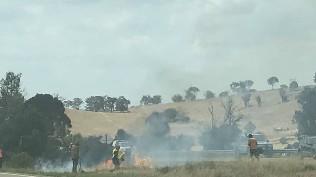 Residents try to put out fire on Barton Highway at Yass