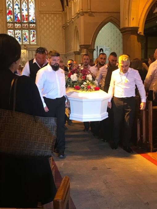 Pallbearers carry the coffin out of the cathedral to 'See You Again' by Charlie Puth.