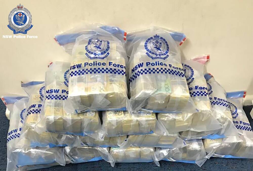 Police seize more than $2.75 million cash found in a prime mover parked in Yass.