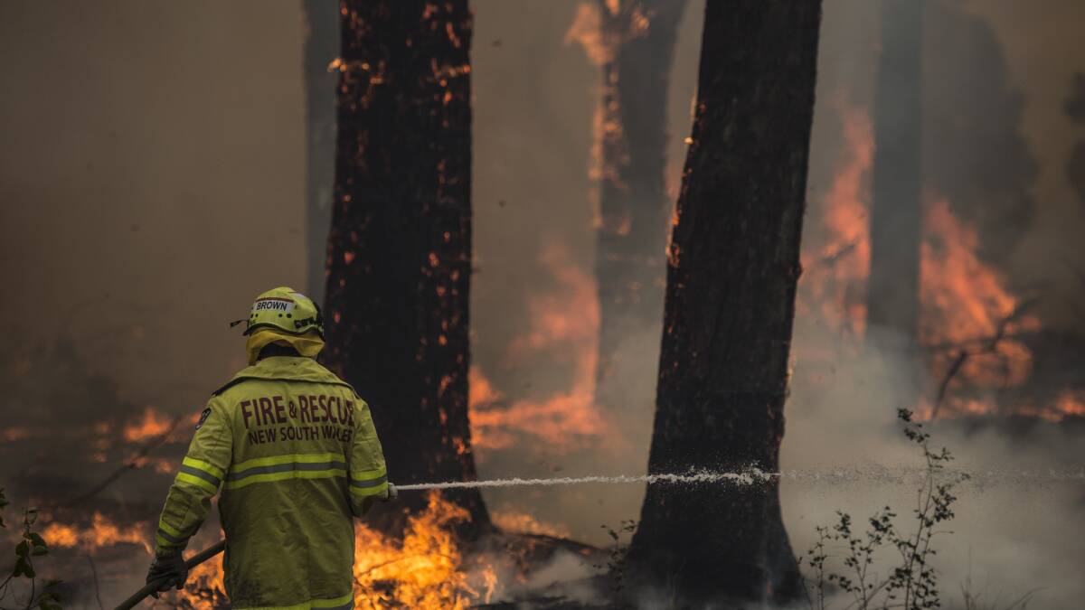 A firefighter works at the scene of a blaze. Picture: Wolter Peeters