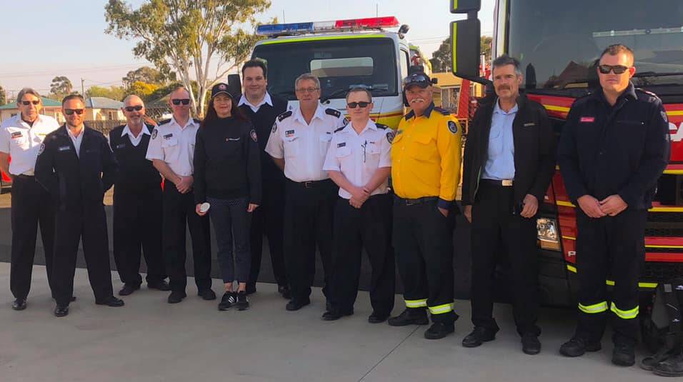 RFS Southern Tablelands Zone operational officer Daniel Osborne (middle back) travels to Queensland to assist with the bushfires. Photo: NSW RFS