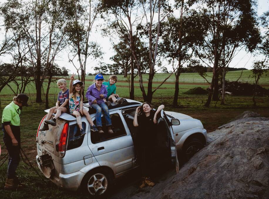 A MOMENT OF RELIEF: The farm is an oasis for Joseph, Naomi, Ned, Charlie and Darcy Cramp from Bannister and Bryn Chapman from Goulburn who have been socially distancing themselves since March 17. Photo: Rachael Cramp