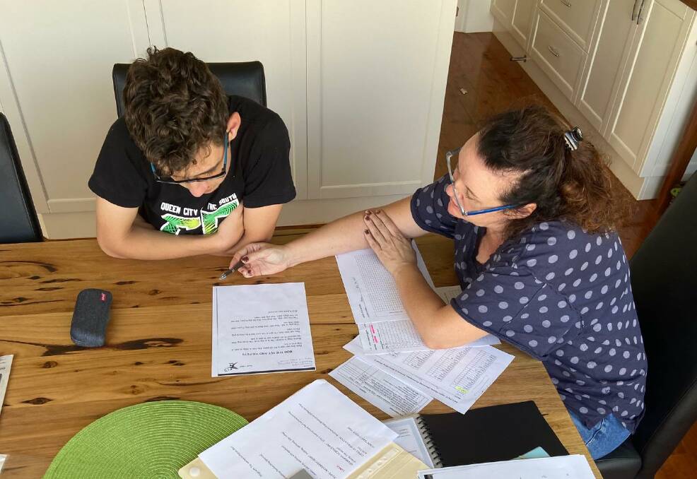 AT HOME: Aspect Riverina School student Aaron Keating at home with mum Yasmin following COVID-19 restrictions. Aaron has autism spectrum disorder. 
