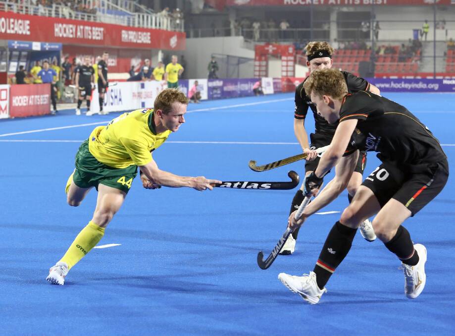 Ben Staines (left) in action against Germany. Picture by the International Hockey Federation.