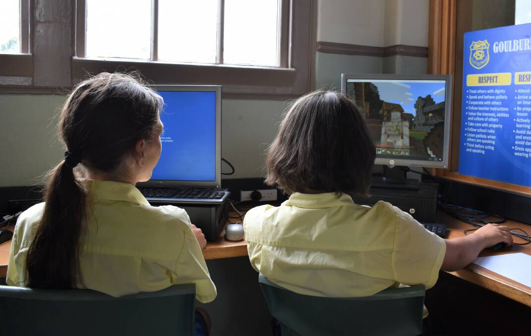 Girls playing Minecraft at school. Photo: Lauren Strode. 