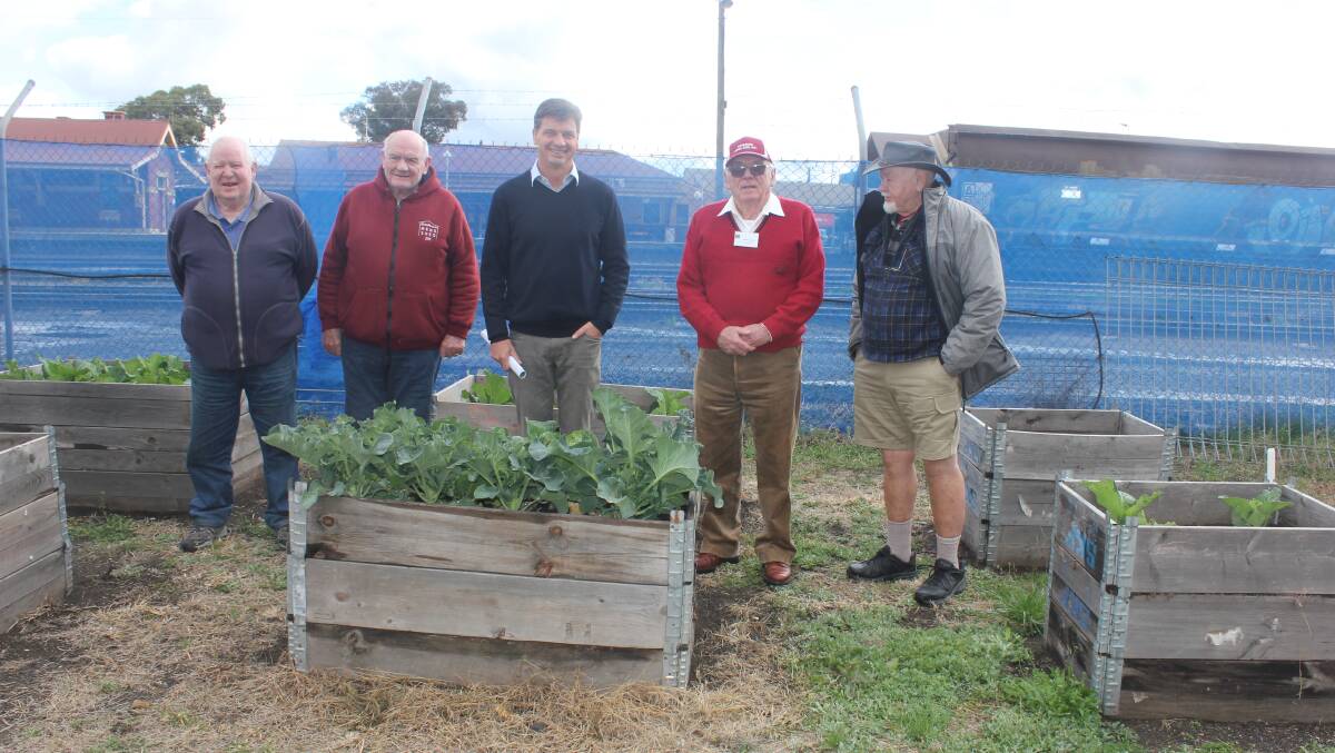 Member for Hume Angus Taylor with members of the Goulburn Men's Shed. Photo: Burney Wong. 