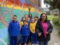 Aboriginal Education Officer Monica Bridge with Goulburn South Public School students who created the mural. Photos: Supplied.  