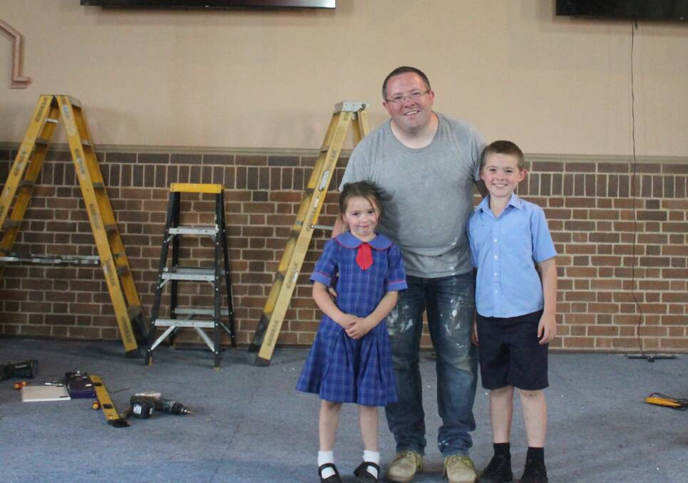 Goulburn Presbyterian Church pastor Mike Adams with two of his kids Emily and Phillip. Photo: Burney Wong. 