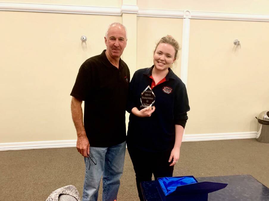 Recognised: 2020 Convoy for Kids president Barry Burrows presenting the award to Emily Townsend. Photo: supplied. 