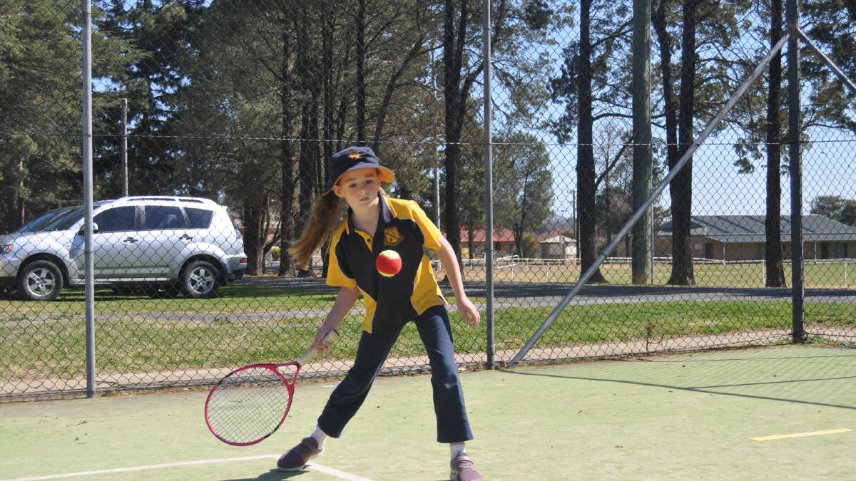 Forehand: Eight-year-old Tully Medway from Gunning Public School having a hit. Photo: Hannah Sparks. 