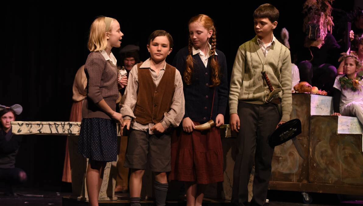 NARNIA: The four main characters are Lucy played by Mae O'Flynn, Edmund played by Joe Stewart-Richardson, Susan played by Bella Remington and Peter played by Gabe Zecevic. Photo credit: Danny Scott.