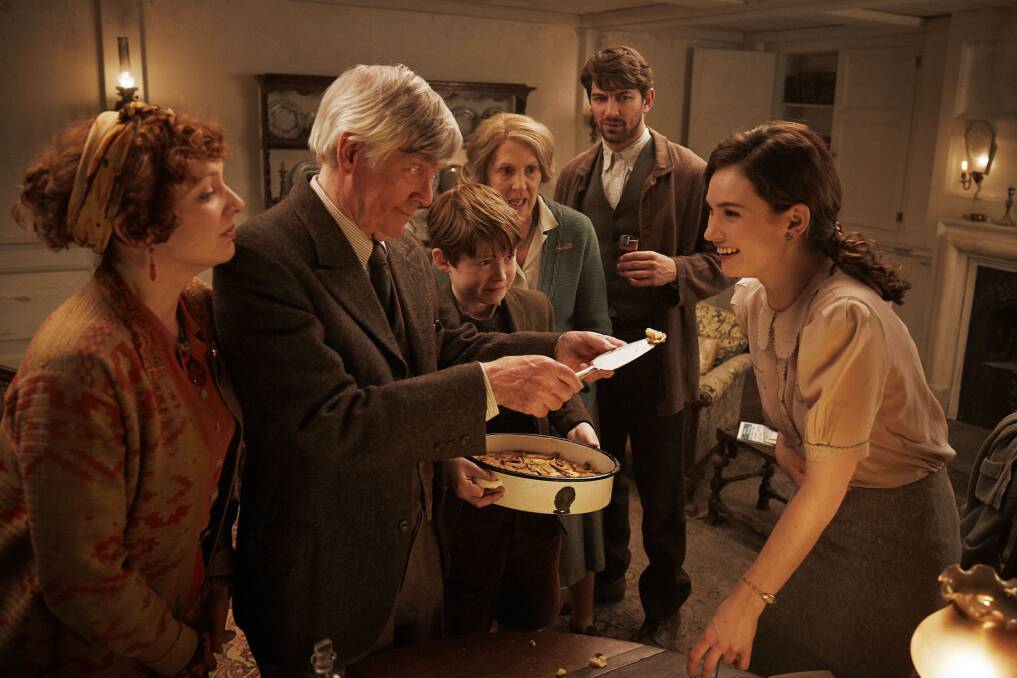 Lily James (right) as Juliet in a scene from the film 'The Guernsey Literary & Potato Peel Pie Society'. Image supplied
