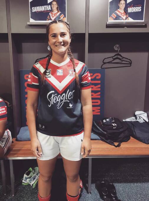 Good spirits: Sassie Economos is proud to be in her Roosters jersey. Photo: supplied. 