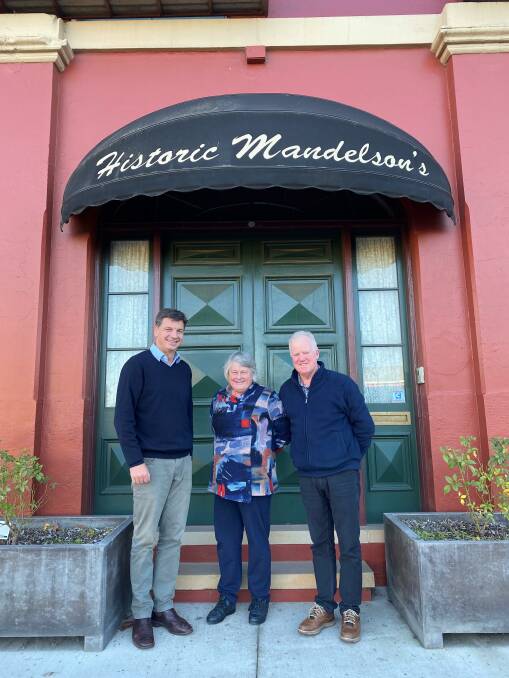 Member for Hume Angus Taylor congratulating the owners of Mandelson's of Goulburn, Stephen and Claire Ayling. Photo: supplied. 