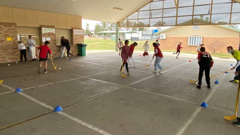 Bradfordville Public School students playing sport. 