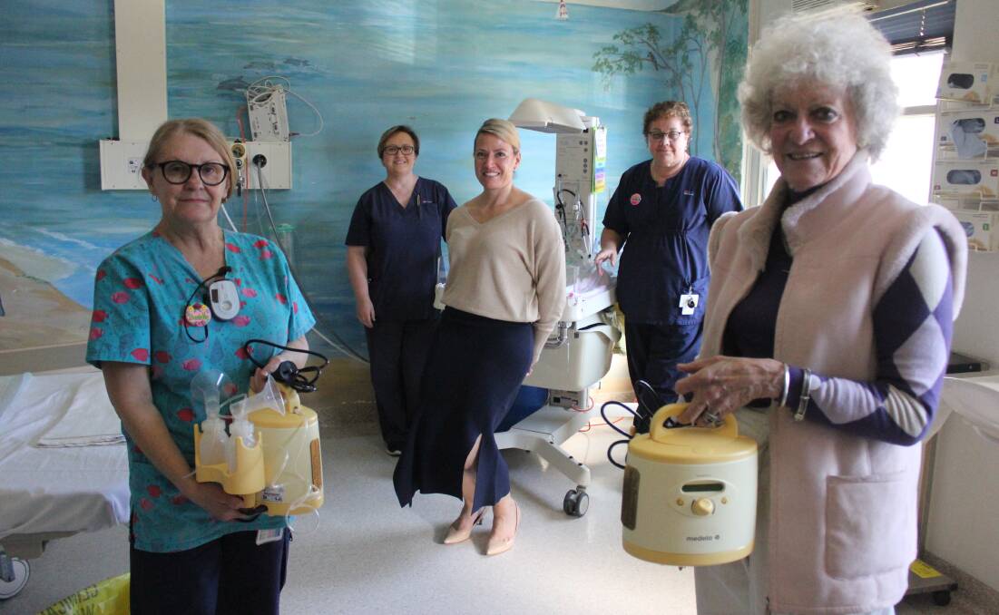 BDCU Goulburn Fundraising Inc president Nerida Cullen and Danelle Millynn holding the breast pumps. 