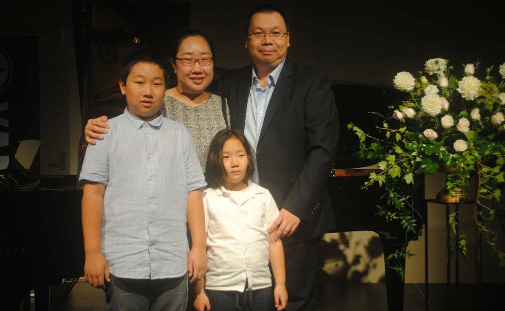 Junior Scholarship recipient Daniel Zhao with his proud family. Picture: Dominic Unwin
