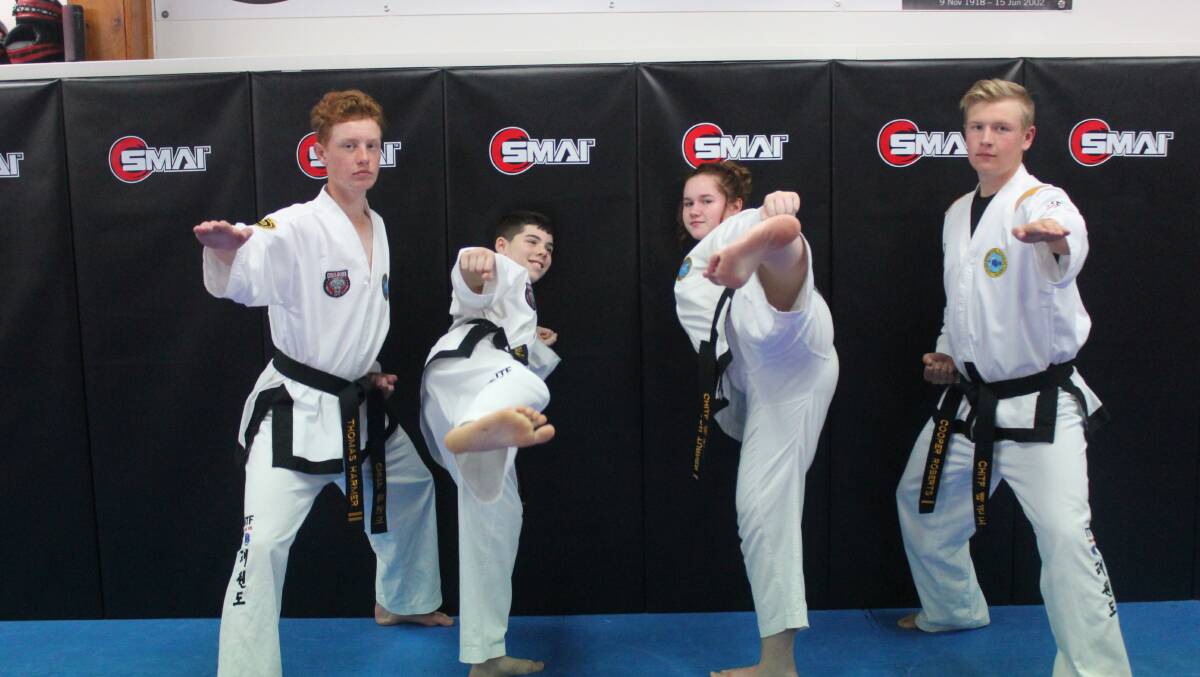 Thomas Harmer, Brendan Graham, Madison Cowie and Cooper Roberts were pleased to receive their second degree black belts. 