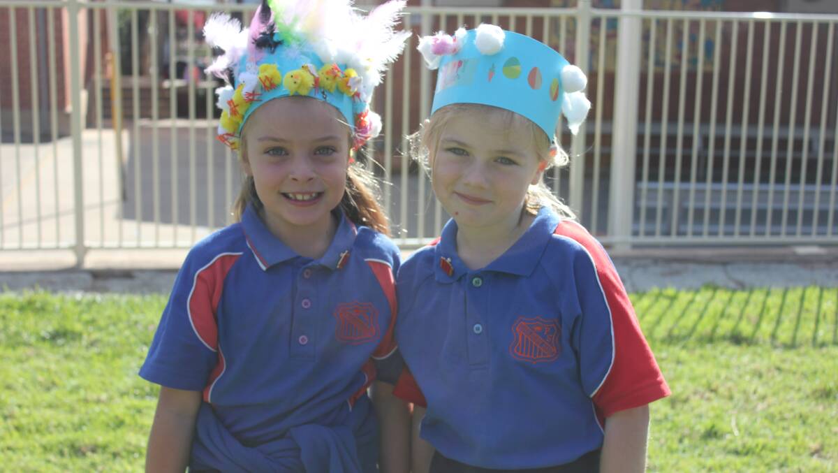 Party mode: Goulburn East Public School students Ella Sharman and Lucy Reardon were enjoying their search for Easter eggs in the school playground. Photo: Burney Wong. 