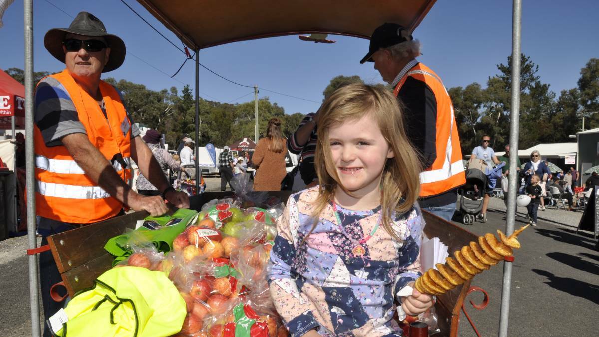 Three-year-old Ruby Hazelton had the box seat at Tallong's popular Apple Day festival in 2018. File pic