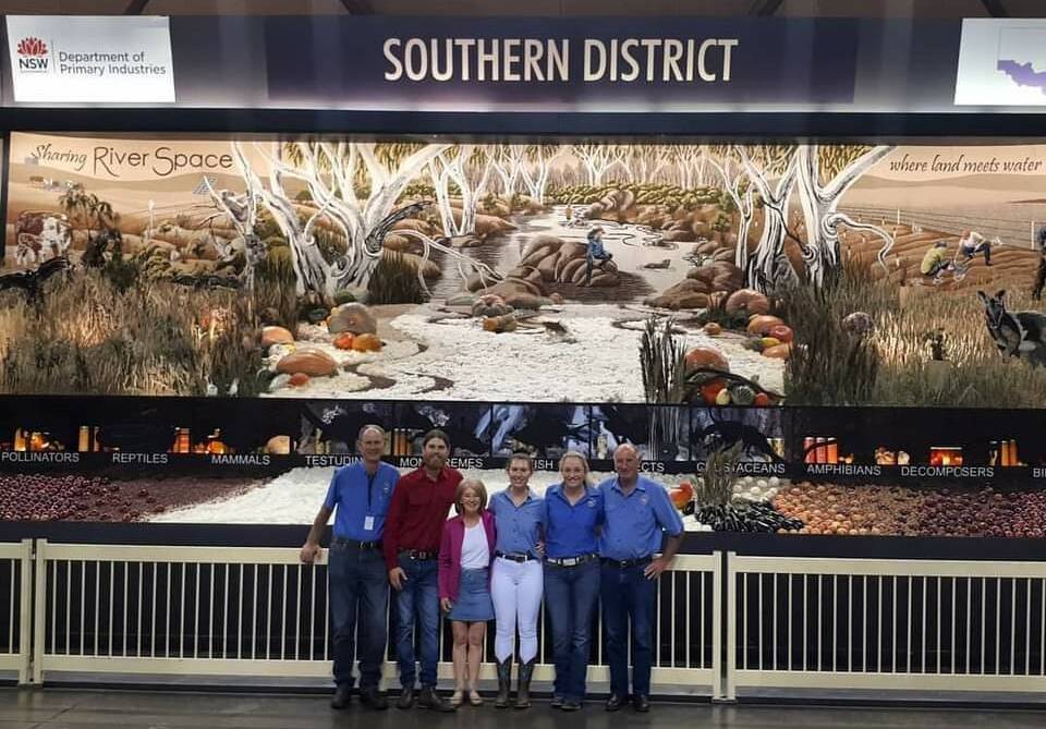 Dave Cullen, Chris Littley, Currawang, Margie Fitzpatrick, Emma Lipscomb, Savannah Hewitt and Ken Hewitt are standing in front of the winning display. Pic: Supplied
