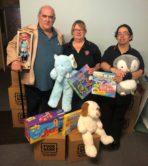 SUPPORT: Captain Tuesday McCall (centre) with Tom Baldock and Cathy Mills. The Salvation Army will help those who are struggling during Christmas with toys and hampers. Photo: Supplied
