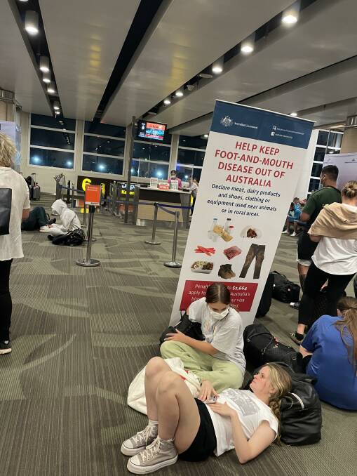 A foot and mouth disease warning sign at the Jetstar boarding gate at Denpasar's Ngurah Rai International Airport in Bali. Picture: Donna Page
