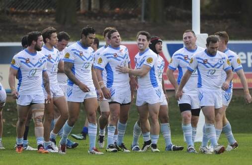 The Queanbeyan Blues celebrate a try. Photo: Graham Tidy. 