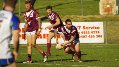 Aaron Gorrell prepares to offload the footy in the Roos clash against Goulburn last weekend. Photo: Darryl Fernance. 
