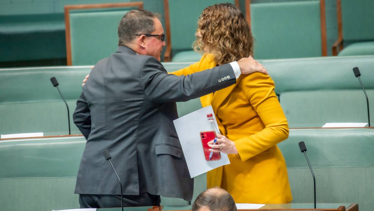 Solomon MP Luke Gosling and Canberra MP Alicia Payne embrace after legislation to repeal the Andrews bill was introduced to the Federal Parliament. Picture: Karleen Minney