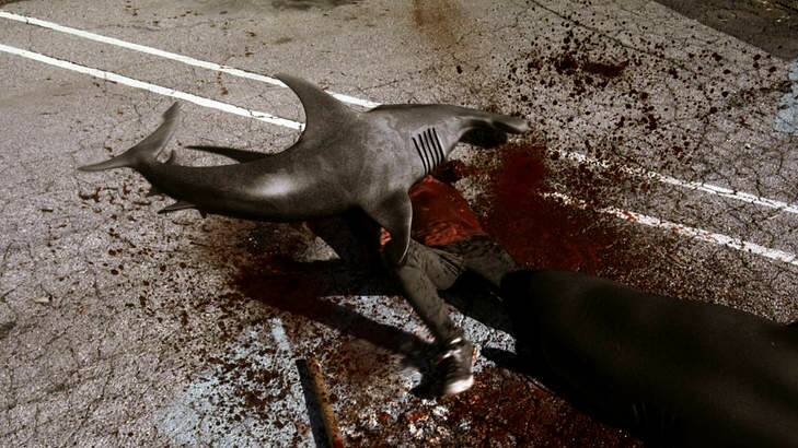 In this image released by Syfy, sharks attack a man in a scene from the Syfy original film <i>Sharknado</i>. Photo: Supplied