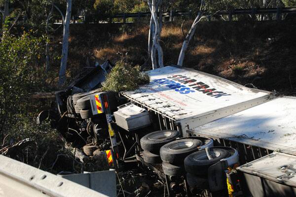 • A 47-year-old Glenfield man was killed when his B-double truck left the road midway between Goulburn and Marulan at 12.45am this morning.  Photos: CHRIS GORDON – Goulburn Post.