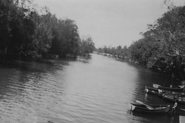 BACK THEN: Boats paddling on the Wollondilly River near the Kenmore Pleasure Grounds in 1949. Photo courtesy Goulburn Mulwaree Council. Inset: The council is purchasing the old boatshed on the former Kenmore Pleasure Grounds as part of 3870 square metre riverside acquisition to boost its public recreation space. A developer is hoping just some of the area’s former glory can be resurrect