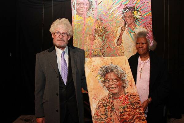 Goulburn artist Gregory S Fergusson with Bonita Mabo in front of the larger portrait of her that he and Samara Littlemore painted and which was unveiled at the Artists Shed last Thursday in Queanbeyan. He also gave Mrs Mabo a smaller portrait that he had painted of her. Photo courtesy of EventPix.