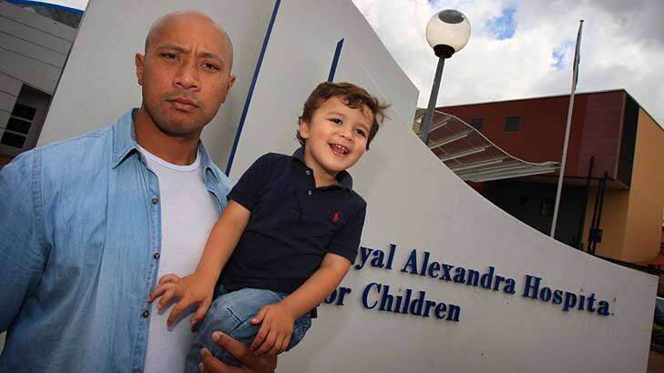 Nightmare ... Frank Puletua with his son Noah outside The Children's Hospital at Westmead.