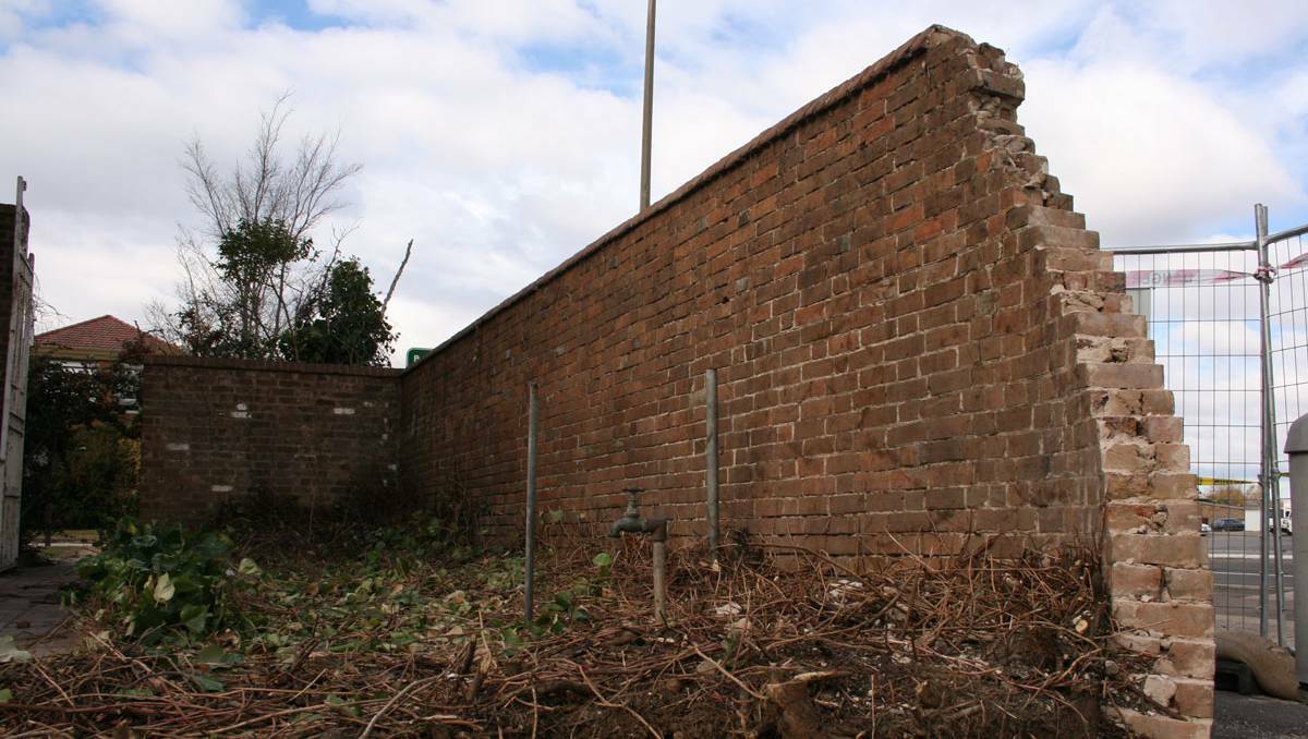  The passage of time and rampant growth are putting something of a lean on one of Goulburn’s historic walls. The wall around the former Marian College campus is about to be repaired. Photo LOUISE THROWER.