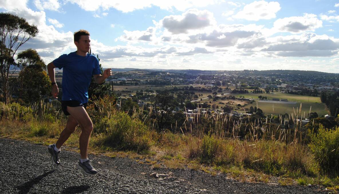 MOUNTAIN CLIMB: Xavier McDonald focused on the upcoming event while training on Rocky Hill.