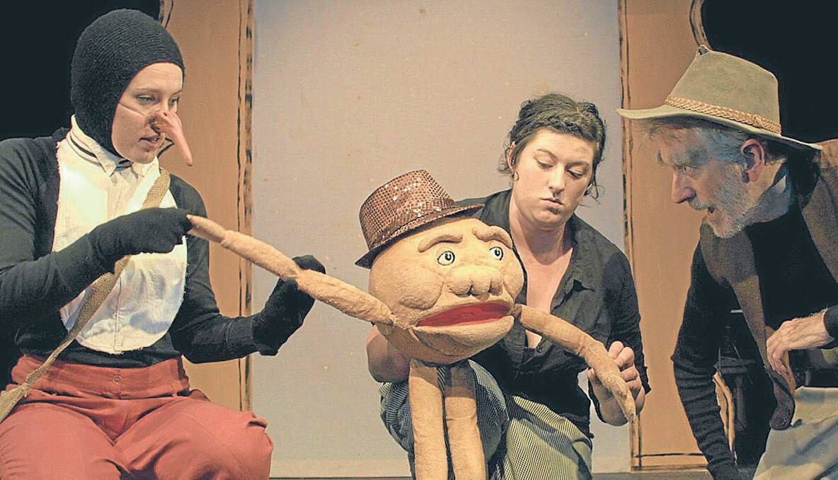 MAGIC: (Above) Puppeteer Cara Jeffery bringing Albert the Magic Pudding to life with a little help from Amanda Aitken and Roger Feltham. Photo by Brian Richardson. 