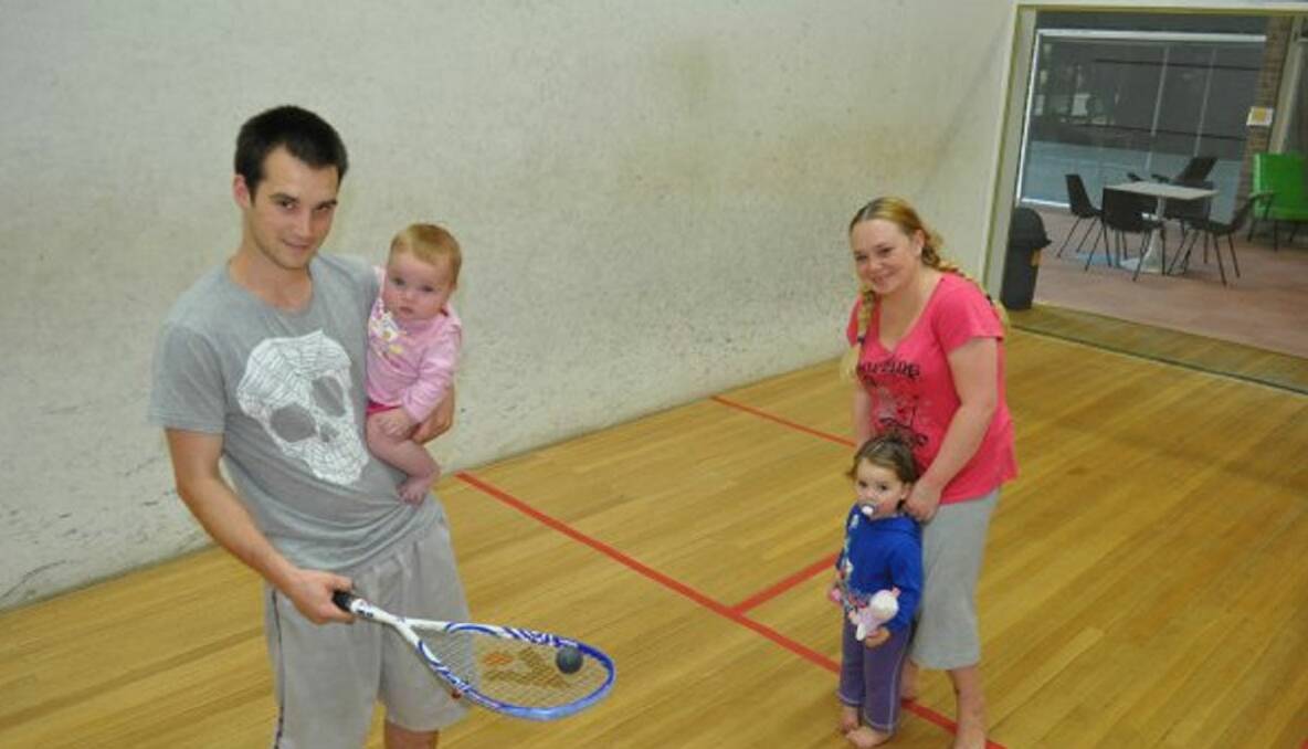 SQUASH CENTRE RETURNS TO SHAPE: Shape Squash and Fitness managers Damien Collins and Dee Frew, with their children Lani, seven months, and Lili, 2.