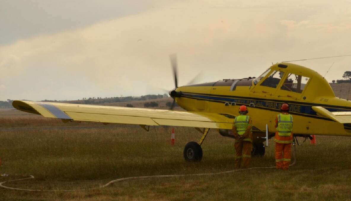 Bomber 223 picking up another load of fire retardant 