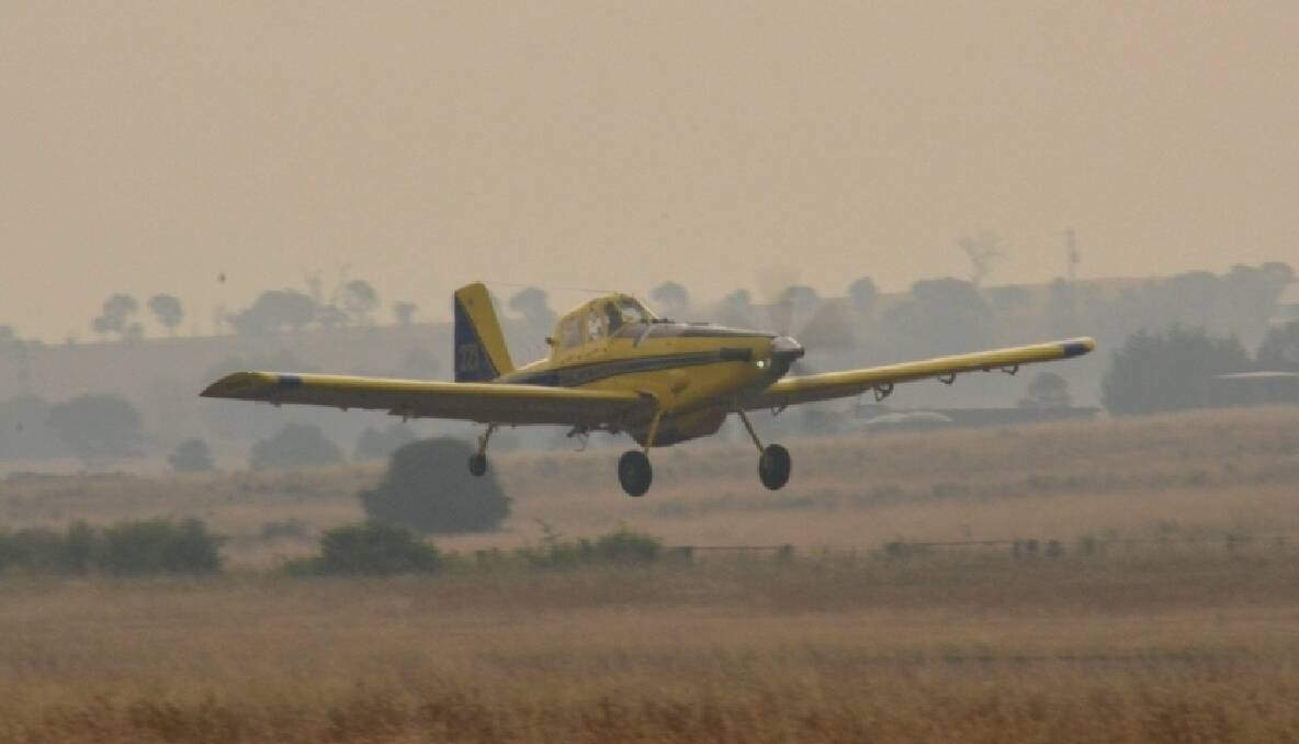 Bomber 223 on takeoff through the smoke RWY 04 Goulburn, loaded with fire retardant heading for the fire 23/12/12. All Photos LINDA MACE.