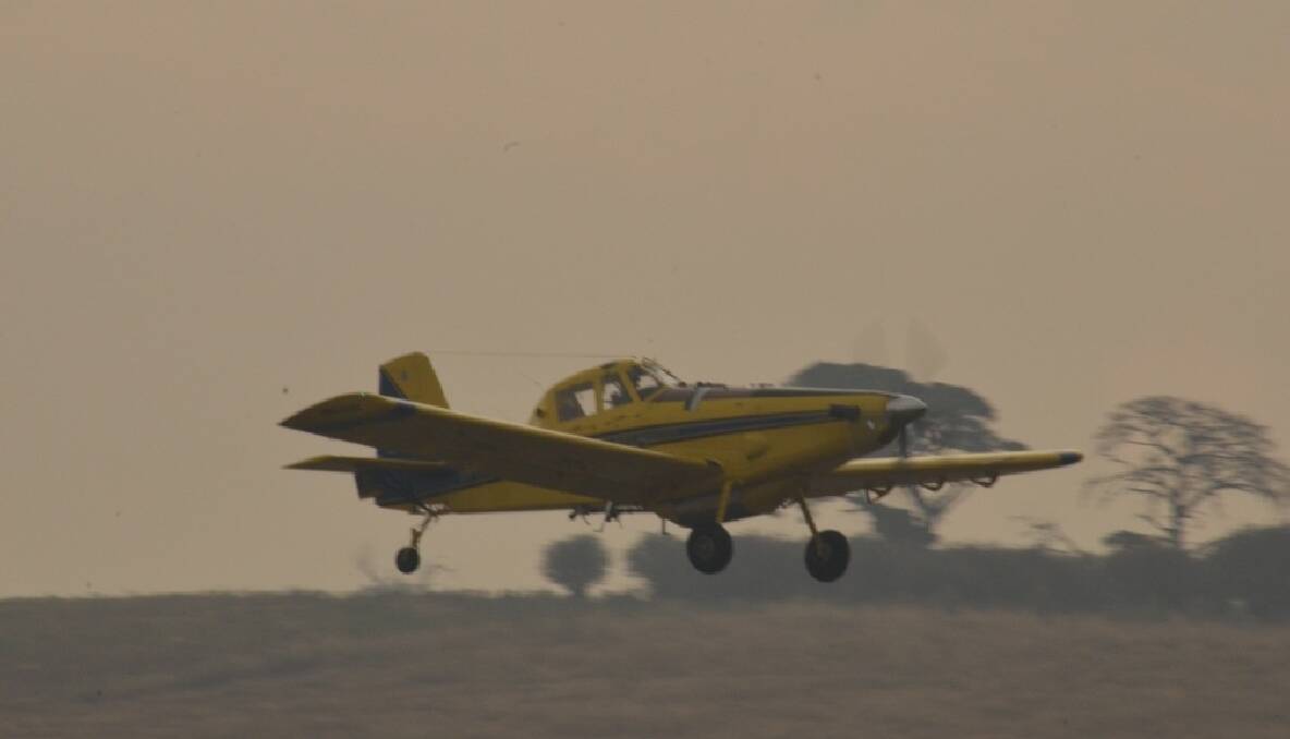 Bomber 223 looms in the smoke on takeoff RWY 04 Goulburn, with another load of fire retardant 23/12/12 