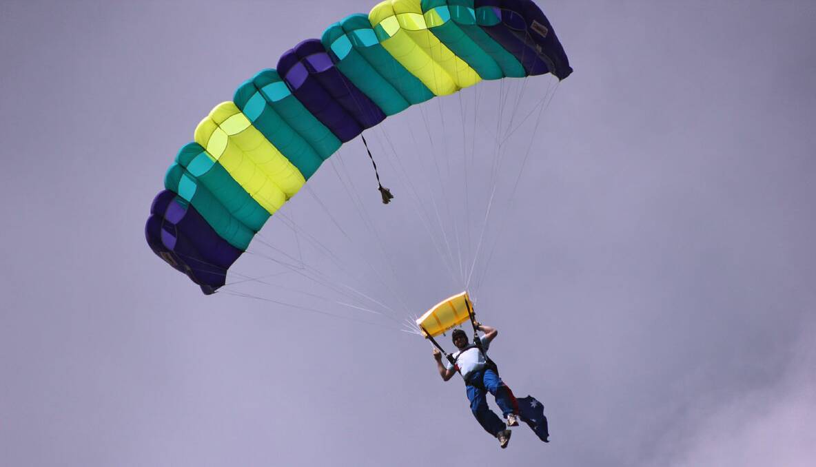 Truckie Ken Enright parachuting into last year’s Goulburn Australia Day celebrations. The identity of the parachutist injured last night has not yet been released. 