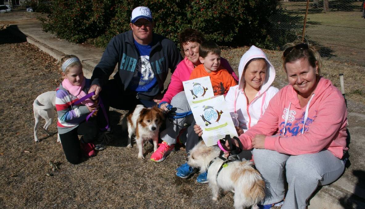 This happy group including (l-r) Annabelle and Jason welsh, Tammy Weatherstone, Lain Weatherstone, Piper Lilly, and dogs, Sophie, Wags and Diamond, enjoyed some sunshine before setting off on the Million Paws walk. Photos LOUISE THROWER.