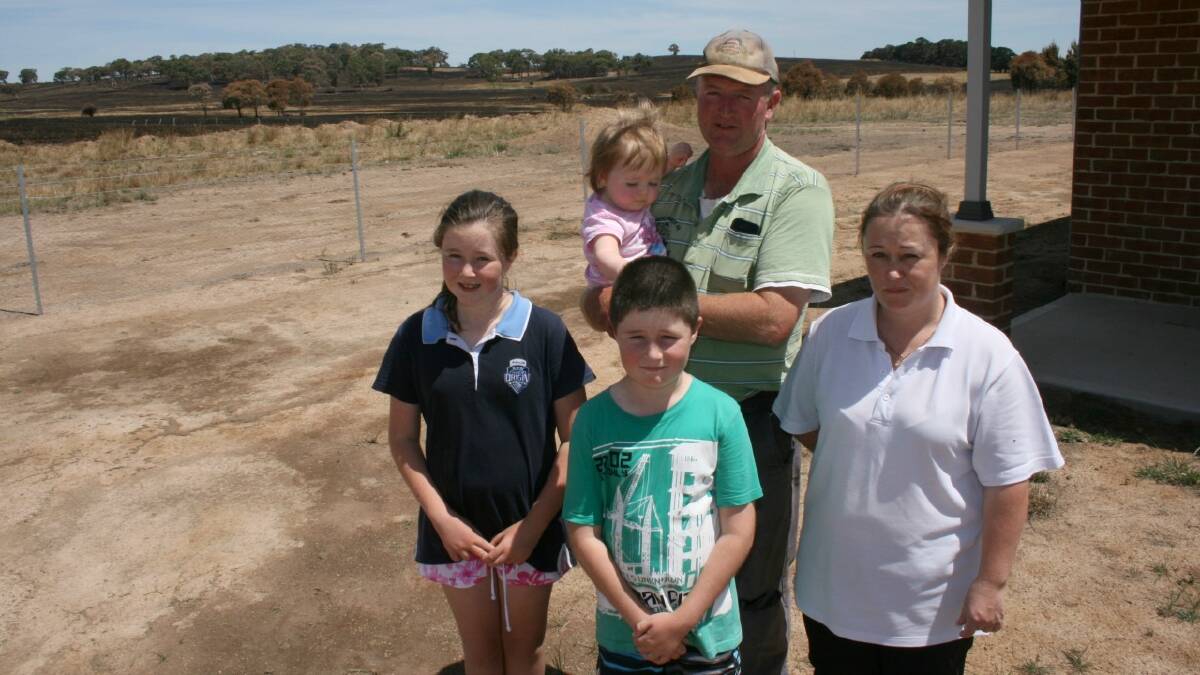 CLOSE CALL: Kristy and Matt Craig lost 36 hectares (90 acres) of their Rosemont Rd property in last Sunday week’s fire. The blaze came within 10 to 20 metres of the newly built home they share with children Pippa (one), Alex, 11, and Jack, eight.